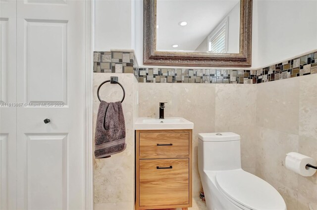 276 NE 90th St, El Portal, FL 33138 - bathroom featuring tile walls, vanity, and toilet