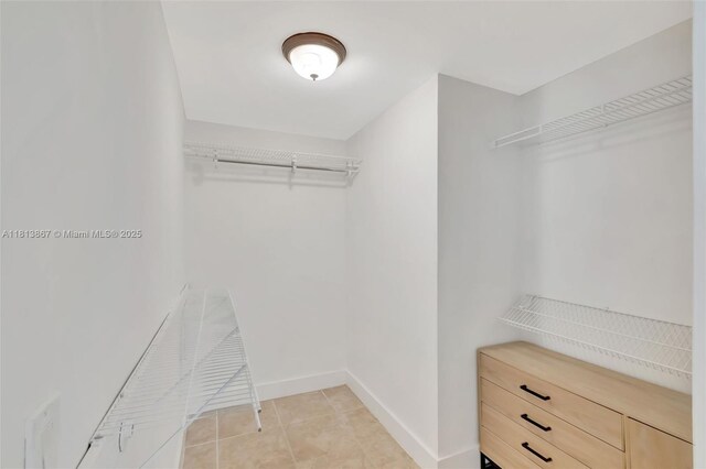 276 NE 90th St, El Portal, FL 33138 - walk in closet featuring light tile patterned floors
