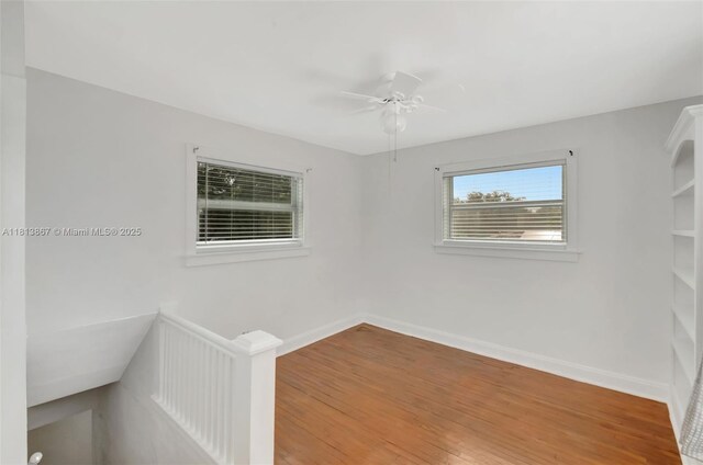 276 NE 90th St, El Portal, FL 33138 - spare room featuring wood finished floors, a ceiling fan, and baseboards
