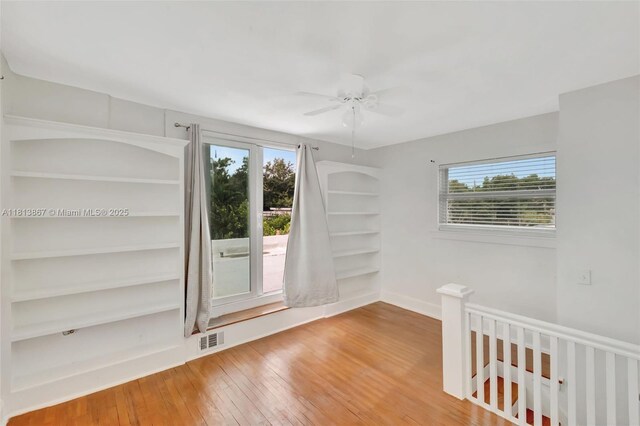 276 NE 90th St, El Portal, FL 33138 - empty room with hardwood / wood-style flooring, ceiling fan, and baseboards