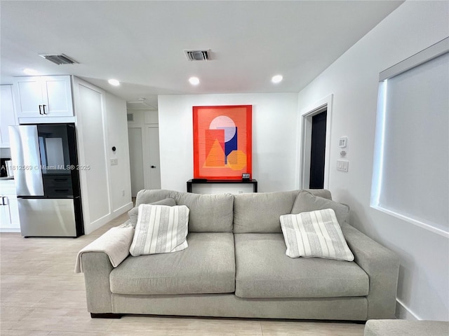1451 NE 155th Ter, North Miami Beach, FL 33162 - living area with recessed lighting and light wood finished floors