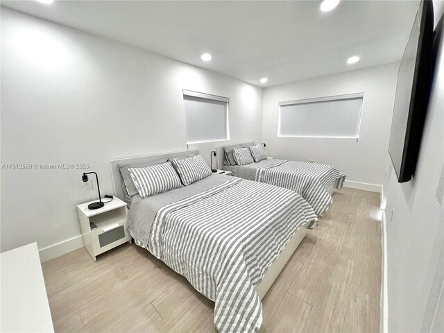 1451 NE 155th Ter, North Miami Beach, FL 33162 - bedroom featuring baseboards, recessed lighting, and light wood-style floors