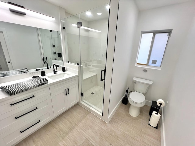 1451 NE 155th Ter, North Miami Beach, FL 33162 - bathroom featuring toilet, vanity, a shower stall, baseboards, and recessed lighting