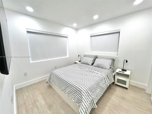1451 NE 155th Ter, North Miami Beach, FL 33162 - bedroom with wood finished floors, baseboards, and recessed lighting