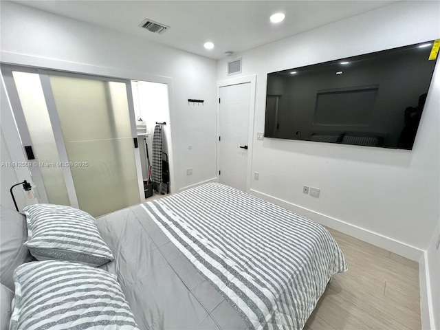 1451 NE 155th Ter, North Miami Beach, FL 33162 - bedroom featuring light wood finished floors, recessed lighting, and baseboards