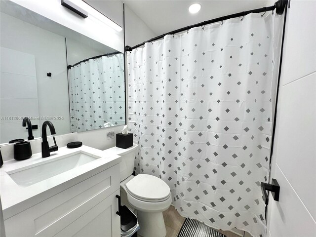 1451 NE 155th Ter, North Miami Beach, FL 33162 - full bath featuring toilet, vanity, tile patterned floors, recessed lighting, and curtained shower