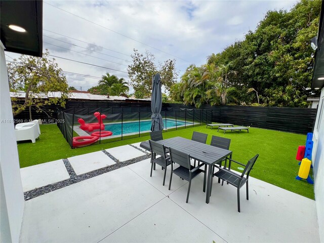 1451 NE 155th Ter, North Miami Beach, FL 33162 - view of patio with outdoor dining space