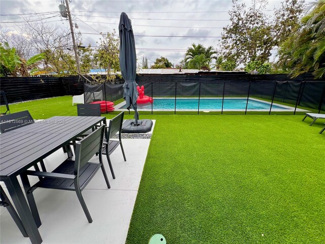 1451 NE 155th Ter, North Miami Beach, FL 33162 - view of yard featuring outdoor dining area and a patio area