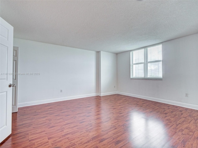 3000 Coral Way Unit 715, Miami, FL 33145 - unfurnished room with dark wood-style flooring and a textured ceiling