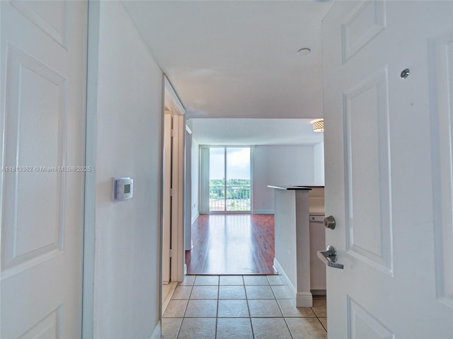 3000 Coral Way Unit 715, Miami, FL 33145 - hallway with light tile patterned flooring and baseboards