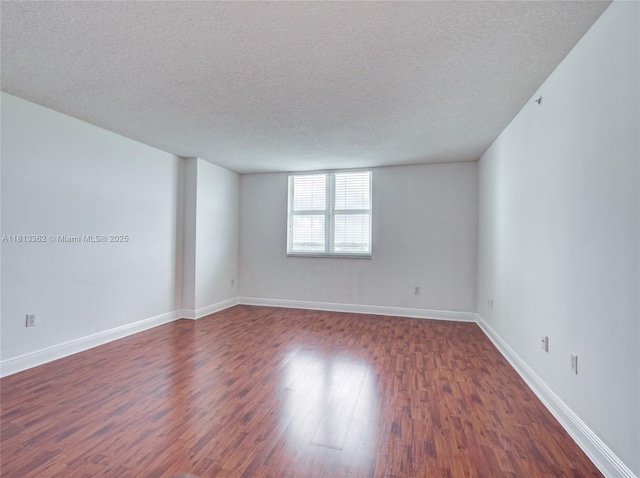 3000 Coral Way Unit 715, Miami, FL 33145 - unfurnished room featuring dark wood finished floors and a textured ceiling