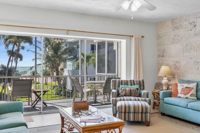 140 Aregood Ln Unit C2, Plantation Key, FL 33036 - living area featuring ceiling fan, plenty of natural light, and a textured ceiling