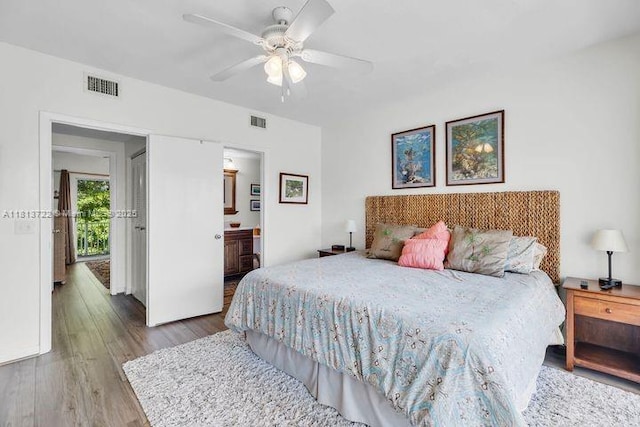 140 Aregood Ln Unit C2, Plantation Key, FL 33036 - bedroom with wood finished floors, ceiling fan, and connected bathroom