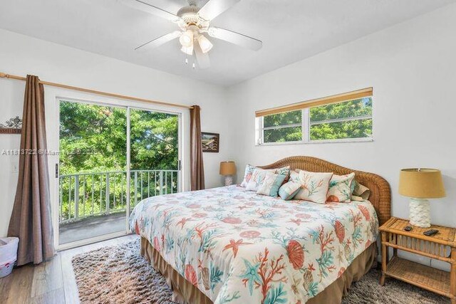 140 Aregood Ln Unit C2, Plantation Key, FL 33036 - bedroom featuring multiple windows, access to outside, wood finished floors, and a ceiling fan