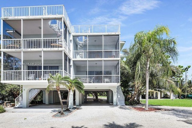 140 Aregood Ln Unit C2, Plantation Key, FL 33036 - view of property with a carport, stairway, and driveway