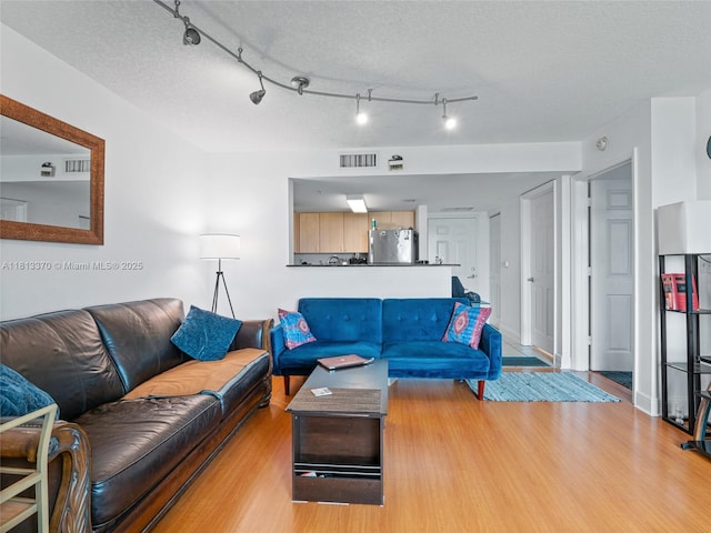 3000 Coral Way Unit 815, Miami, FL 33145 - living area featuring wood finished floors and a textured ceiling