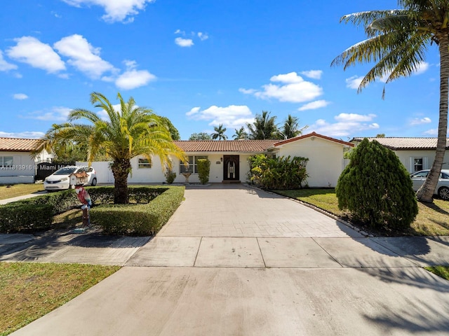 1715 SW 102nd Ct, Miami, FL 33165 - view of front of house with concrete driveway, stucco siding, and a tile roof