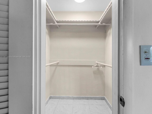 1715 SW 102nd Ct, Miami, FL 33165 - walk in closet featuring marble look tiles