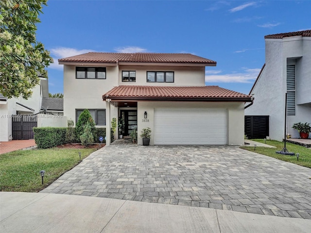 3638 SW 57th Ave, Miami, FL 33155 - mediterranean / spanish-style house featuring stucco siding, decorative driveway, and a tiled roof