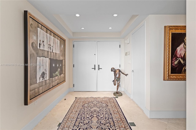 3 Grove Isle Dr Unit C1610, Miami, FL 33133 - hall with recessed lighting, baseboards, and a tray ceiling