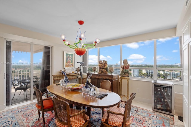 3 Grove Isle Dr Unit C1610, Miami, FL 33133 - dining space featuring wine cooler, plenty of natural light, a chandelier, and a city view