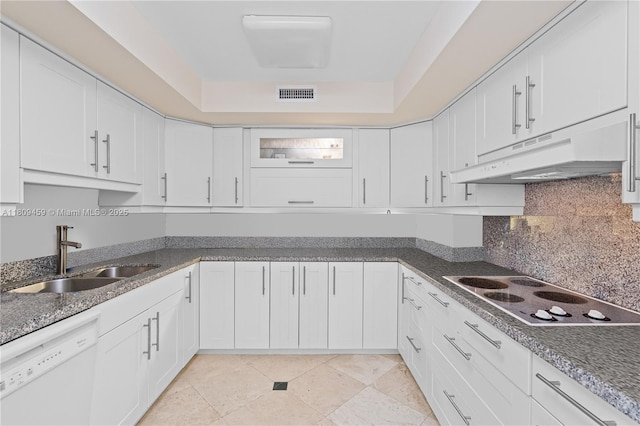 3 Grove Isle Dr Unit C1610, Miami, FL 33133 - kitchen with white appliances, a sink, under cabinet range hood, white cabinets, and tasteful backsplash