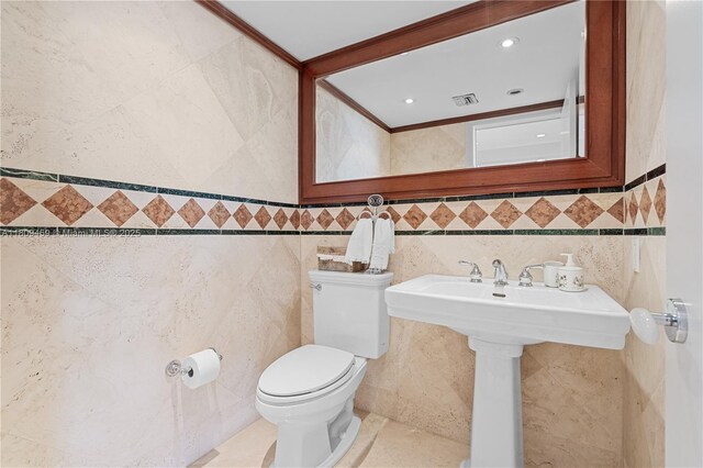 3 Grove Isle Dr Unit C1610, Miami, FL 33133 - half bath featuring tile walls, toilet, and tile patterned floors