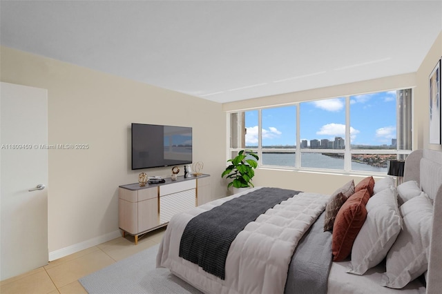 3 Grove Isle Dr Unit C1610, Miami, FL 33133 - bedroom featuring light tile patterned floors and baseboards