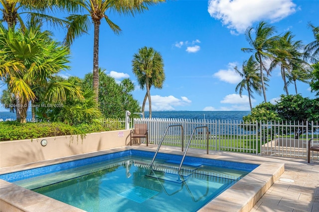 3 Grove Isle Dr Unit C1610, Miami, FL 33133 - view of pool with a pool, a hot tub, a water view, and a patio area