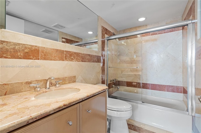 3 Grove Isle Dr Unit C1610, Miami, FL 33133 - full bathroom with bath / shower combo with glass door, vanity, tile walls, and recessed lighting