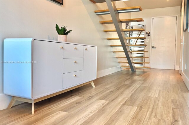 690 SW 1st Ct Unit 1006, Miami, FL 33130 - stairway with wood finished floors and baseboards