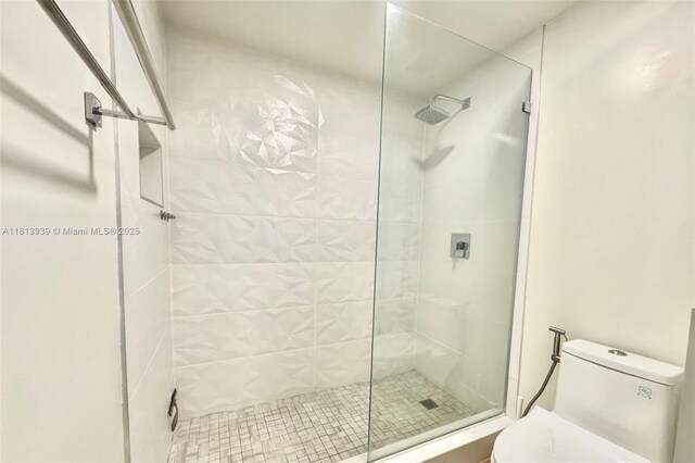 690 SW 1st Ct Unit 1006, Miami, FL 33130 - bathroom featuring toilet and a stall shower