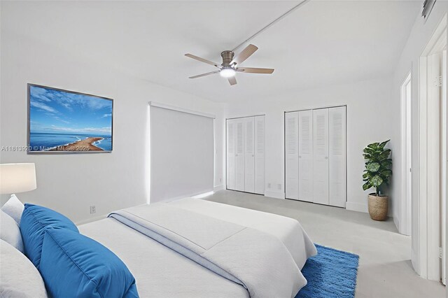 13455 SW 9th Ct Unit 315J, Pembroke Pines, FL 33027 - bedroom with multiple closets, ceiling fan, and baseboards