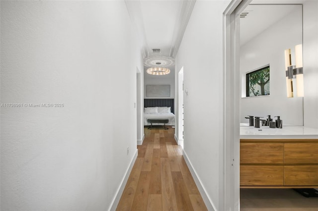 1060 NE 95th St, Miami Shores, FL 33138 - hall featuring light wood-type flooring and ornamental molding