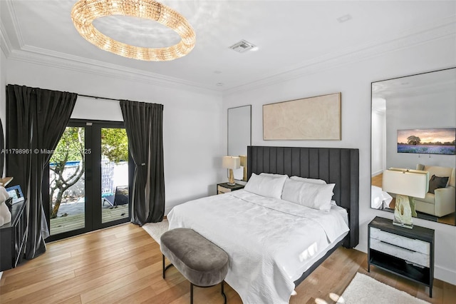 1060 NE 95th St, Miami Shores, FL 33138 - bedroom featuring access to exterior, hardwood / wood-style flooring, crown molding, and french doors