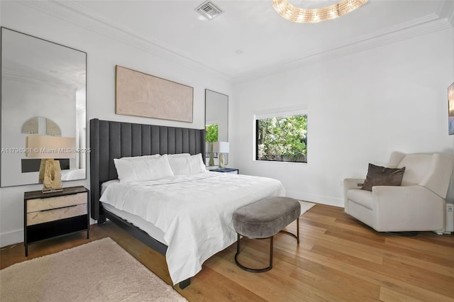 1060 NE 95th St, Miami Shores, FL 33138 - bedroom featuring crown molding and wood finished floors