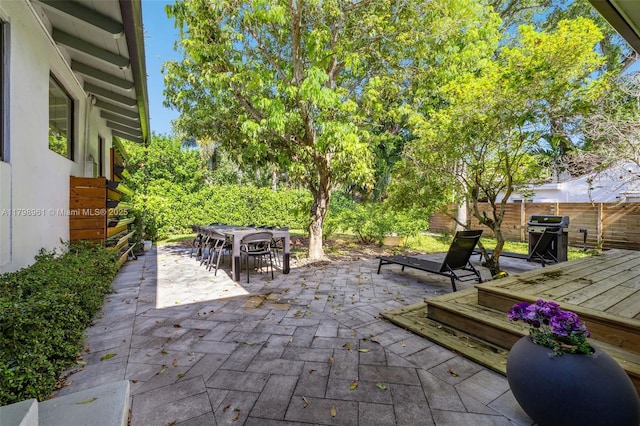 1060 NE 95th St, Miami Shores, FL 33138 - view of patio featuring grilling area and outdoor dining area