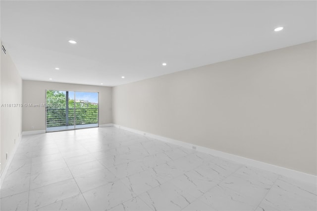 2006 Granada Unit J4, Coconut Creek, FL 33066 - unfurnished room featuring recessed lighting, baseboards, and light marble finish floors