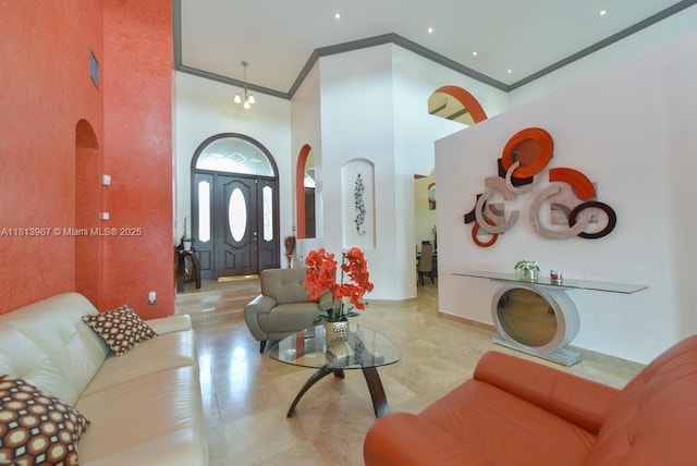 19686 SW 130th Ave Rd, Miami, FL 33177 - living area featuring arched walkways, a towering ceiling, and crown molding