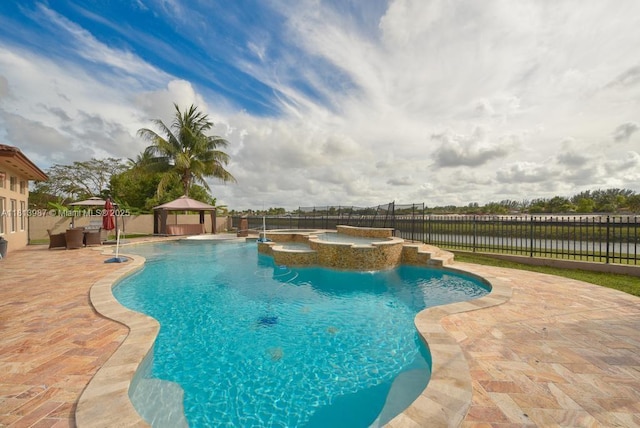 19686 SW 130th Ave Rd, Miami, FL 33177 - view of swimming pool with a gazebo, a pool with connected hot tub, a fenced backyard, and a patio