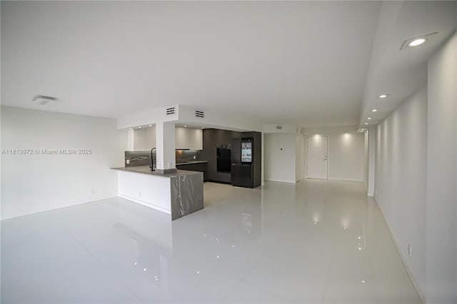 200 Leslie Dr Unit 314, Hallandale Beach, FL 33009 - unfurnished living room with recessed lighting and baseboards