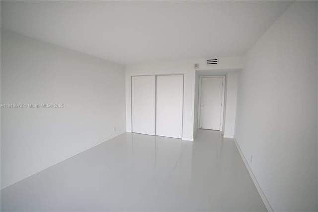 200 Leslie Dr Unit 314, Hallandale Beach, FL 33009 - unfurnished bedroom featuring a closet and baseboards