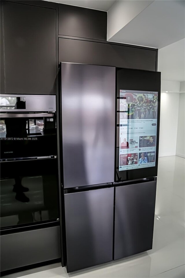 200 Leslie Dr Unit 314, Hallandale Beach, FL 33009 - kitchen view of freestanding refrigerator, modern cabinets, and dark cabinets