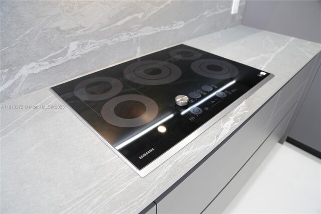 200 Leslie Dr Unit 314, Hallandale Beach, FL 33009 - kitchen view of black electric stovetop and light countertops