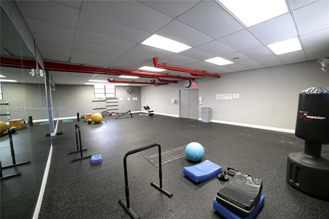 200 Leslie Dr Unit 314, Hallandale Beach, FL 33009 - exercise room with baseboards and a drop ceiling