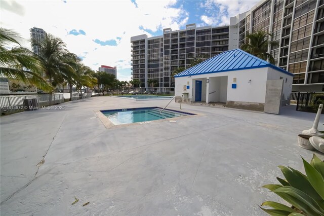200 Leslie Dr Unit 314, Hallandale Beach, FL 33009 - community pool with a hot tub and a patio