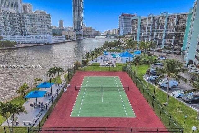 200 Leslie Dr Unit 314, Hallandale Beach, FL 33009 - view of tennis court featuring a view of city and a water view