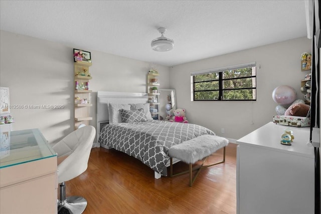 3030 SW 117th Ave, Davie, FL 33330 - bedroom featuring wood finished floors and a textured ceiling