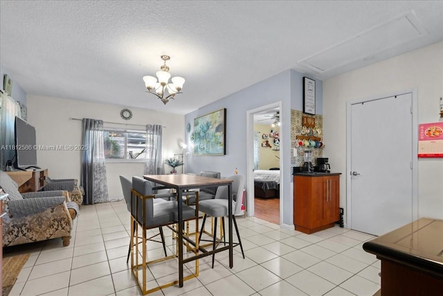 3030 SW 117th Ave, Davie, FL 33330 - dining area with light tile patterned floors, a chandelier, and a textured ceiling