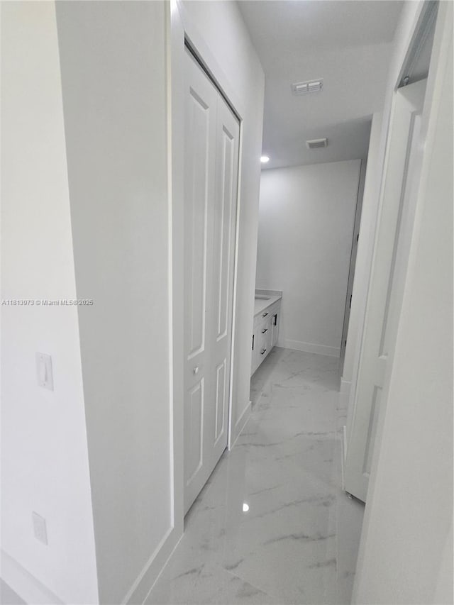 987 Edgerton, Lehigh Acres, FL 33974 - hall featuring light marble finish floors and baseboards